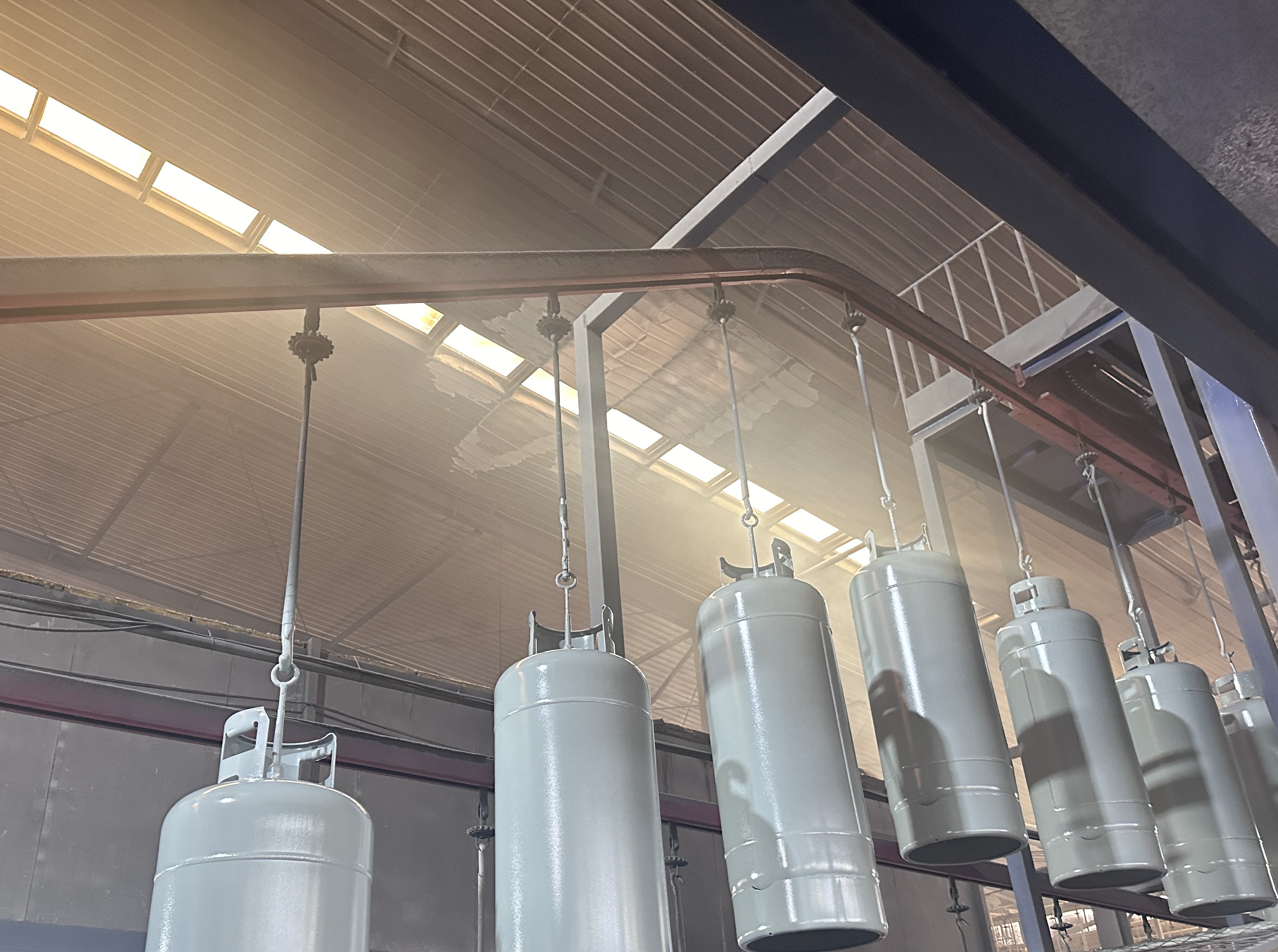 Why do LPG cylinders need to be coated?